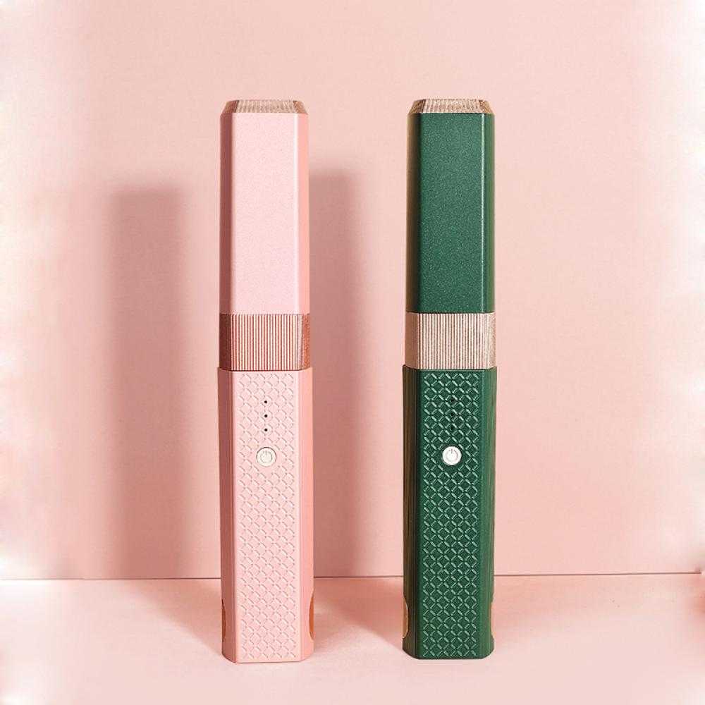 sleek black curling wand with rose gold accents