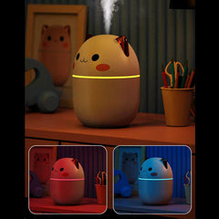 Cute cat humidifier with USB power and LED night light, compact and quiet design, ideal for small spaces like bedrooms, offices, or kid’s rooms.